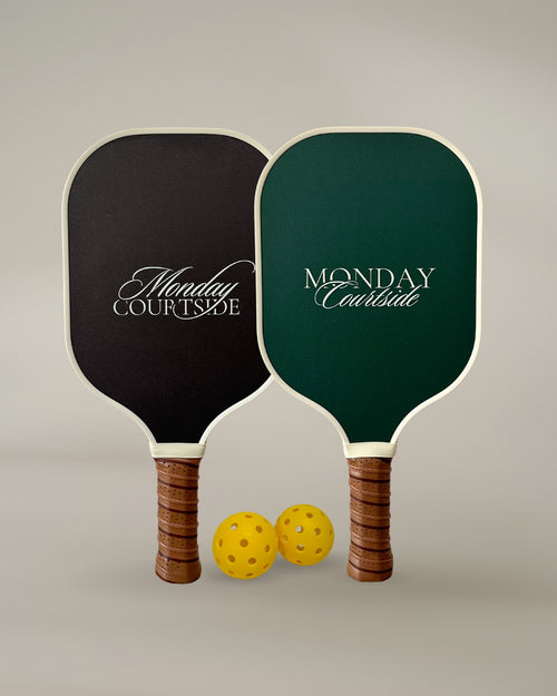 Front view of two premium pickleball paddles in Darkwood and Court Green, part of the Signature Courtside Set for all levels of play