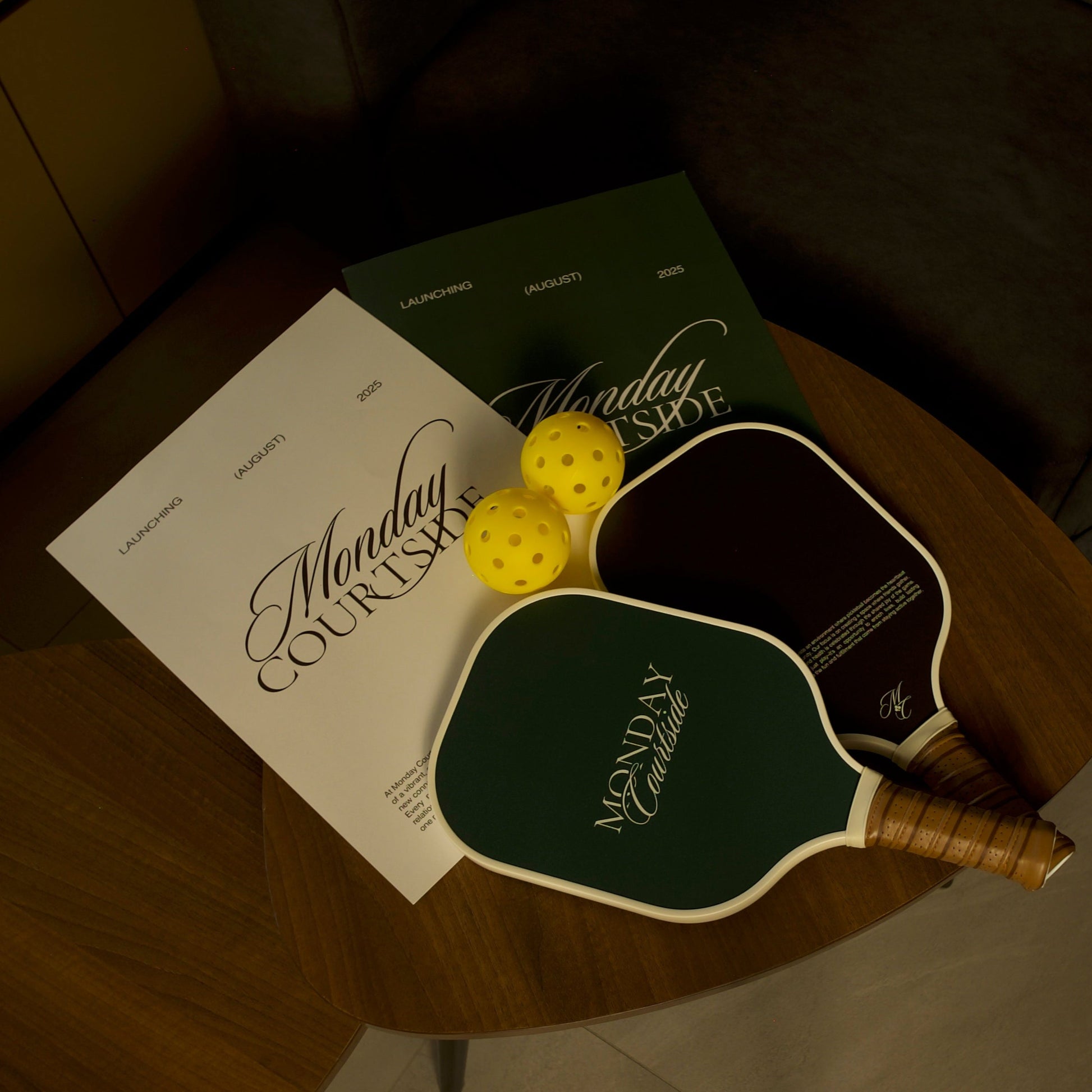 Signature Courtside pickleball paddles resting flat on a tabletop, showcasing balanced design and modern finish